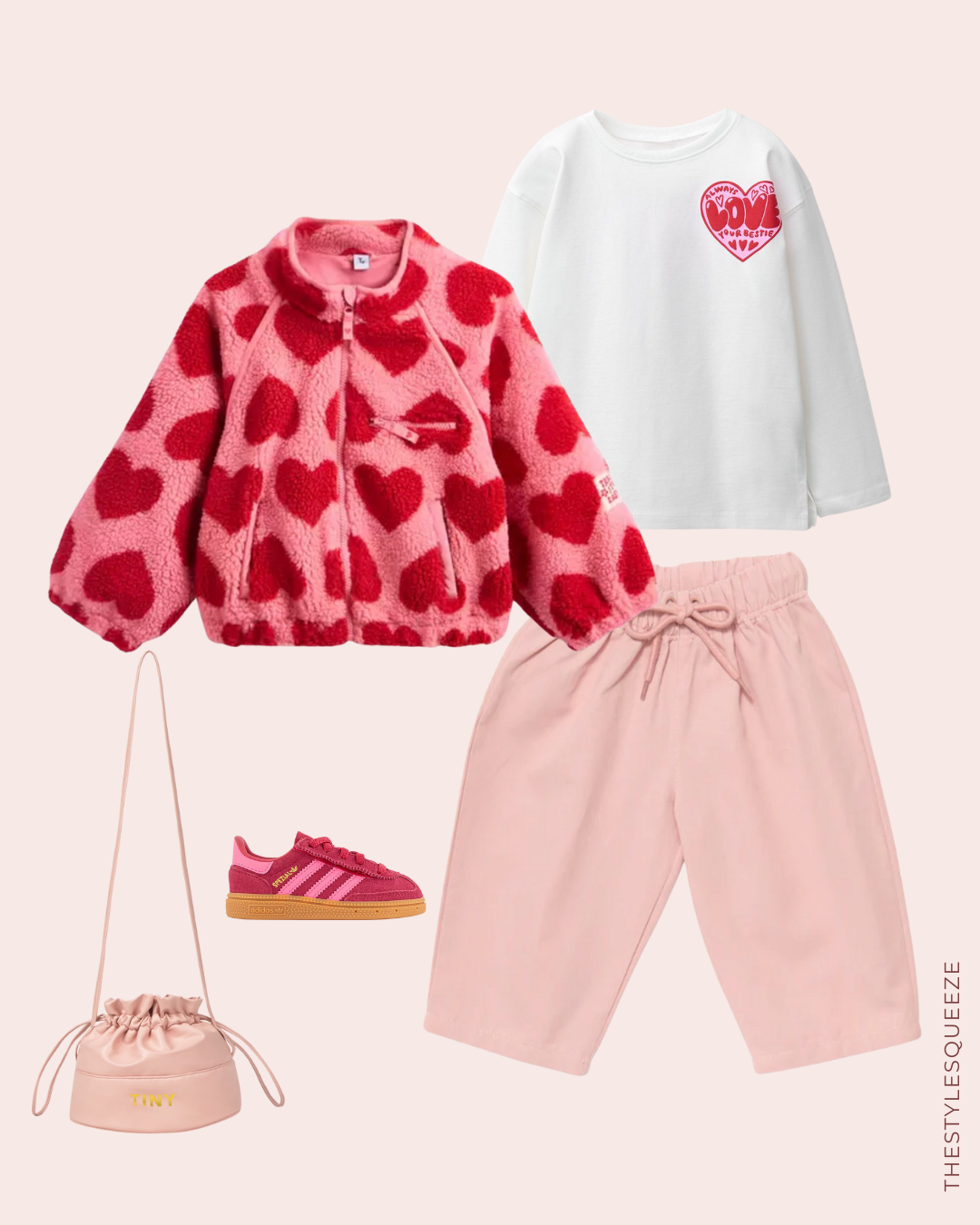 heart print pink and red fleece for kids, white heart print t-shirt, pink drawstring trousers, pink handbag and Adidas trainers