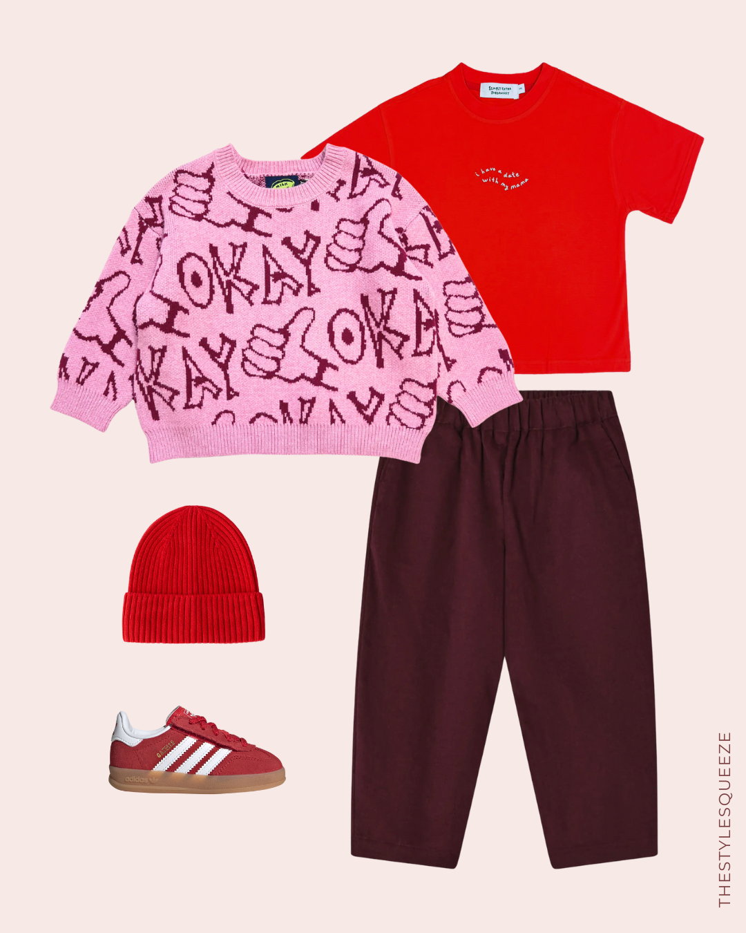 pink okay print jumper, burgundy trousers, red t-shirt, hat and Adidas trainers